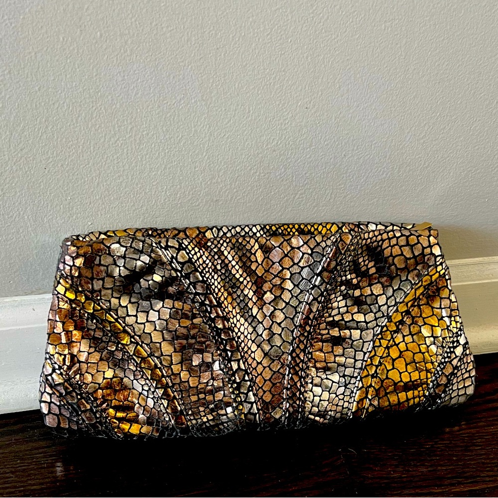 New, never used faux snakeskin metallic clutch